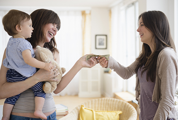 Woman Paying Babysitter