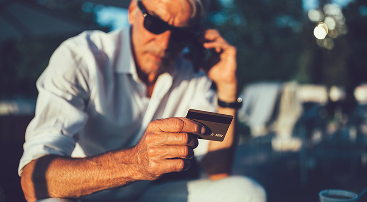 guy staring at card in confusion