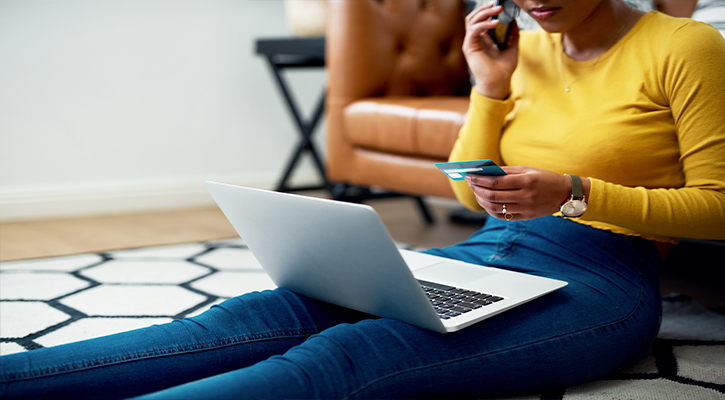 girl on laptop using credit card