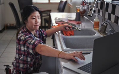 woman working on kitchen sink