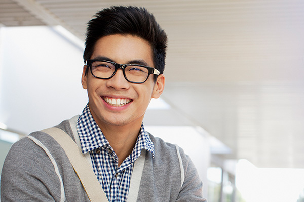 happy student with glasses