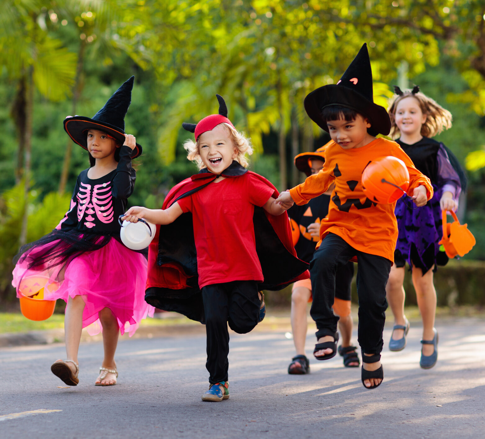 children in halloween costumes running