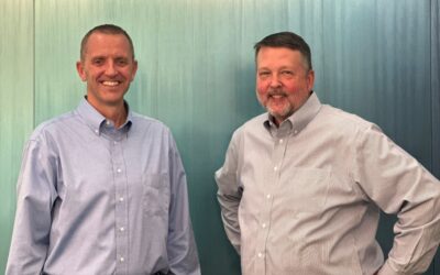 Centra Chief Growth Officer Brad Davis poses with Centra President and CEO Rick Silvers