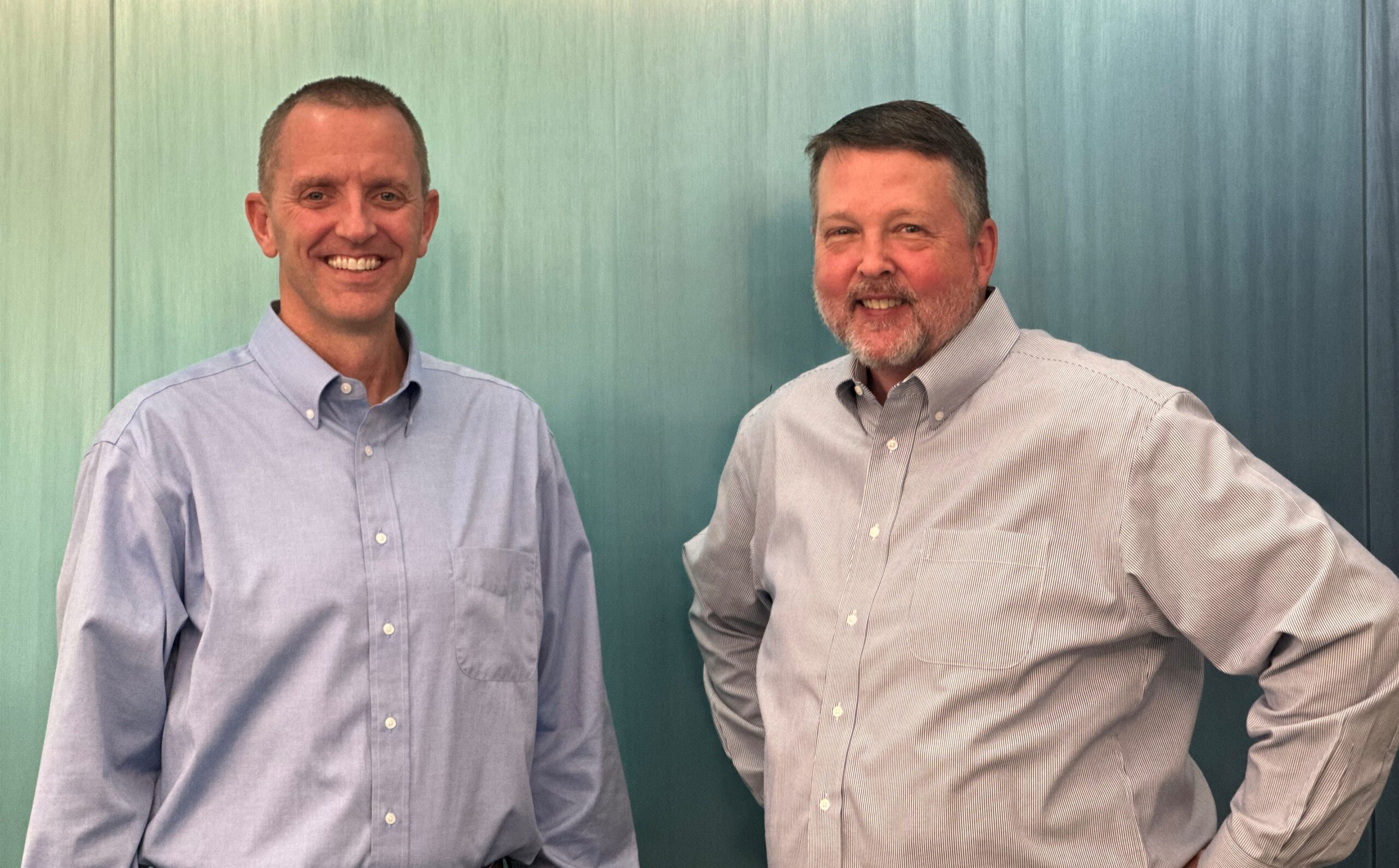 Centra Chief Growth Officer Brad Davis poses with Centra President and CEO Rick Silvers